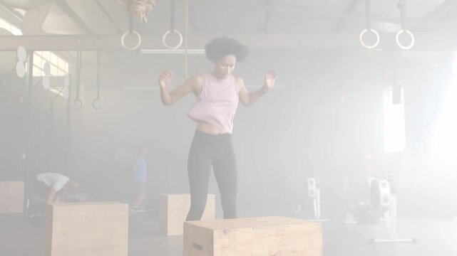 Adult woman shifting, swinging arms, jumping box with animated rep counter for fitness training