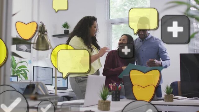 Team celebrating win in office, woman reaching high-fiving while icons covering laptop, teal folder