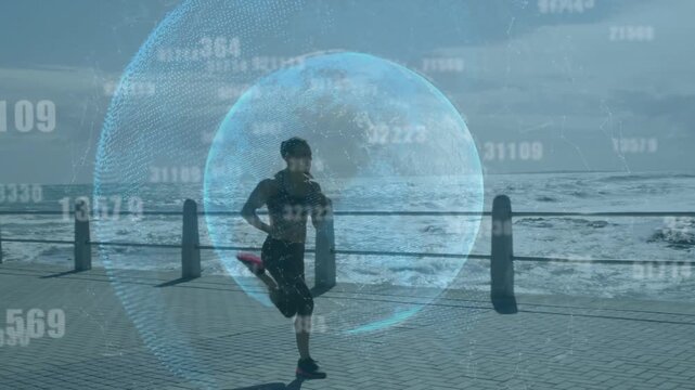 Female runner starting jog along coast railing, passing bollards while holo sphere showing fitness