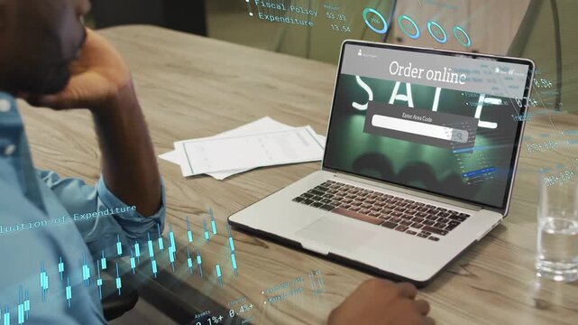 Worker moving right hand to trackpad and analyzing ecommerce sales with SALE HUD overlays on laptop