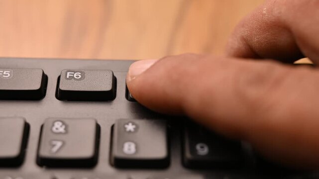 Pressing F7 Key on Computer Keyboard for Spell Check Function