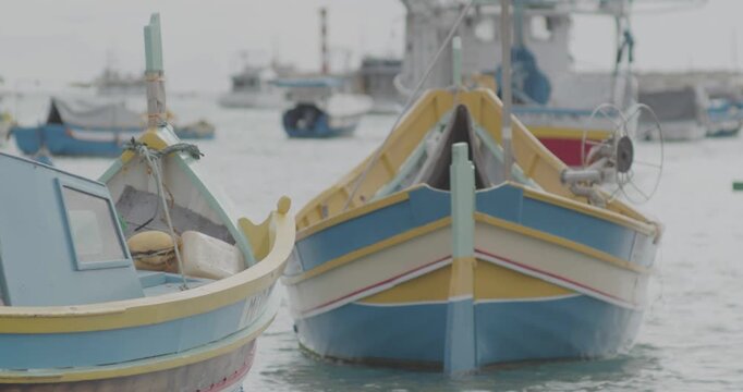 Colorful Traditional Fishing Boats Floating on Calm Water