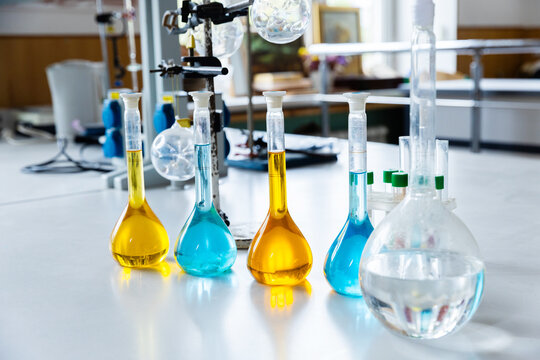 Colorful Chemistry Experiment in a Modern Laboratory Showcasing Various Test Tubes Filled With Vibrant Liquids