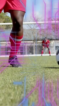 Vertical video: Soccer player sports shifting, nudging ball by goal readying shot under glitch