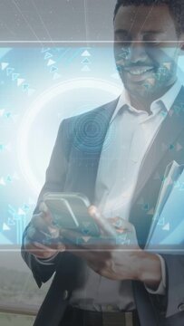 Vertical video: Man in suit tapping phone, causing HUD rings morphing into globe map for business