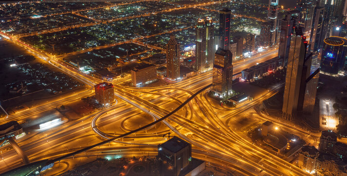 Dubai Night Aerial View of Highway Interchange and Illuminated Cityscape