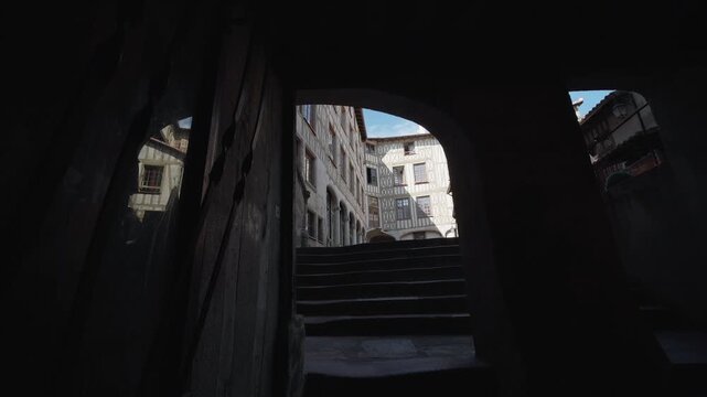 Historic alley seen from a vaulted passage in Limoges