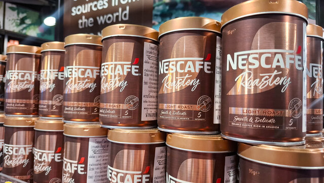 Group of Nescaf&eacute; Gold Roastery Light Roast Coffee Tins Displayed on a Supermarket Shelf on April 20, 2026 in Bangkok, Thailand 
