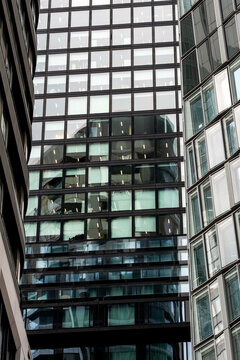 Urban facade architecture glass windows texture pattern modern Bankenviertel Frankfurt financial district building surface with crisp geometry