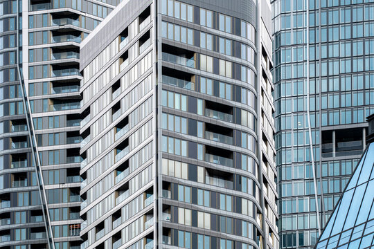 Skyscraper architecture tower with glass facade windows vertical modern Bankenviertel Frankfurt financial district view in clear daylight