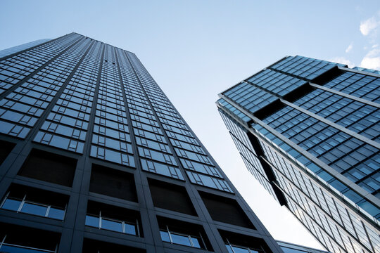 Modern skyscraper architecture tower with glass facade perspective skyline urban Bankenviertel Frankfurt financial district daylight