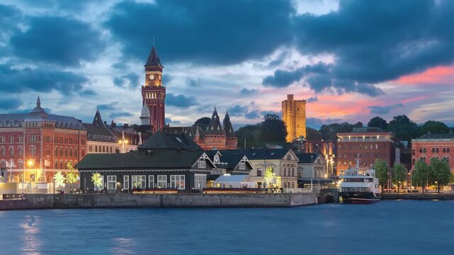 Helsingborg, Sweden. City skyline at dusk  (static image with animated sky nad water)