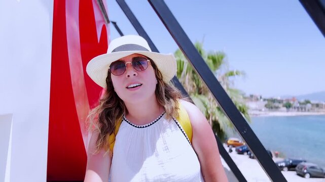 Influencer vlogging on vacation in piraeus, athens