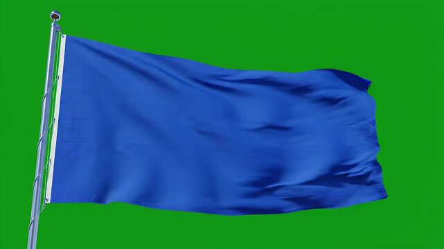 A vibrant blue flag waves gently in the breeze against a bright green screen, showcasing its flowing fabric and dynamic movement.