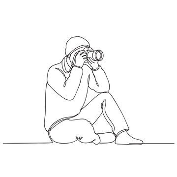 Photographer sitting on ground, shooting with camera, one line art, artistic.