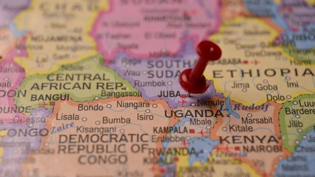 Hand Pointing Juba South Sudan with Red Pin on World Map 4K 60fps