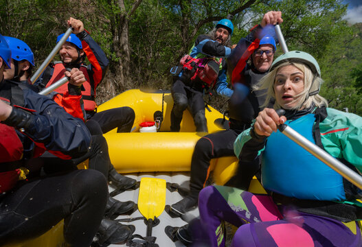 Extreme roller coaster rafting, scared team in an inflatable boat on a river