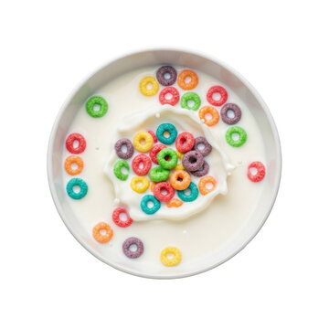 Top view of colorful fruit cereal loops in a bowl of milk with a splash.