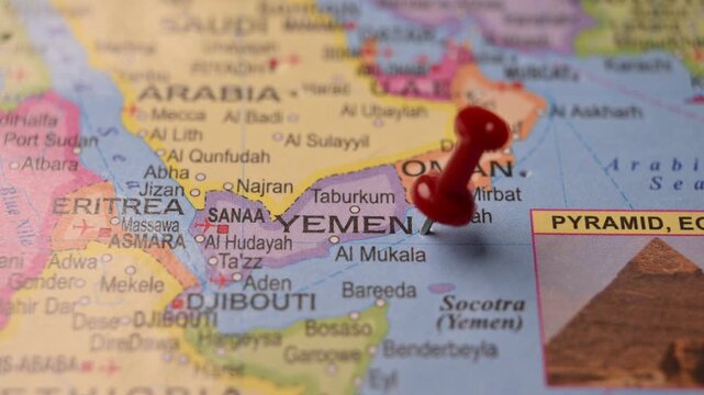 Hand Pointing Yemen with Red Pin on World Map 4K 60fps