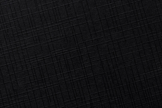 Black ripstop fabric texture background. High detailed macro shot of durable synthetic material,Macro,Top view of black waterproof ripstop nylon fabric with a characteristic grid pattern. Technical.