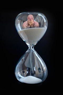 A genie is inside a hourglass waiting to come out.