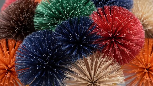 A vibrant collection of colorful pipe cleaner flowers arranged in a bouquet against a neutral backdrop.