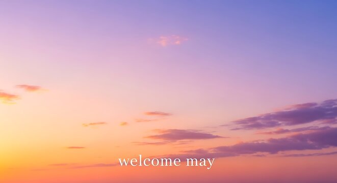 vibrant may sunset sky with warm gradient welcome message on horizon