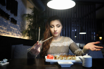 Fototapeta premium Beautiful girl in a cafe
