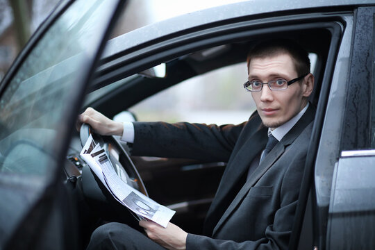 Man in a business suit in the car