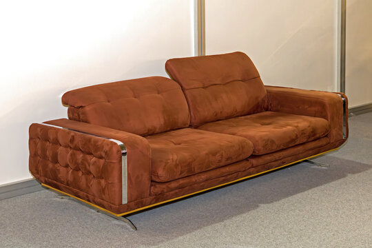 Brown leather upholstery material couch inside empty room interior