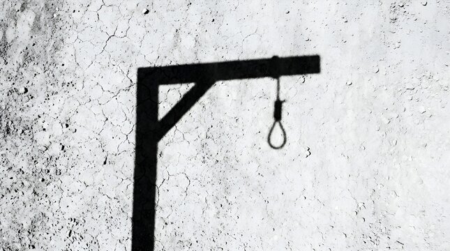 Dark Shadow of Wooden Gallows with Noose on Textured Concrete Wall Representing Execution and Justice