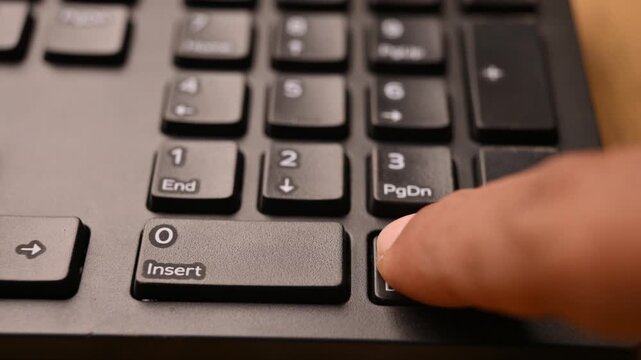 Pressing Backspace Key on Keyboard to Delete Text on Computer