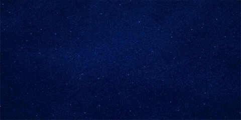 Abstract dark blue space background featuring a textured starry galaxy nebula with glowing light patterns across a deep cosmos universe © Sayid
