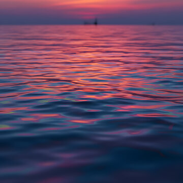 Sunset Reflection on Gentle Ocean Waves