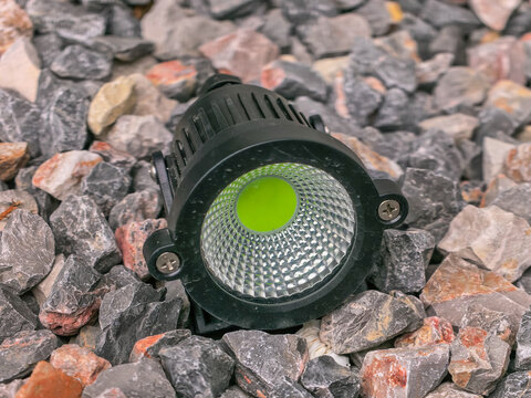 Waterproof outdoor spotlight for backyard and pathway illumination, and for landscape lighting on rocks.
