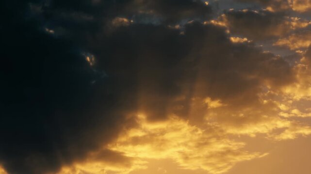 celestial sunbeams filter through the clouds