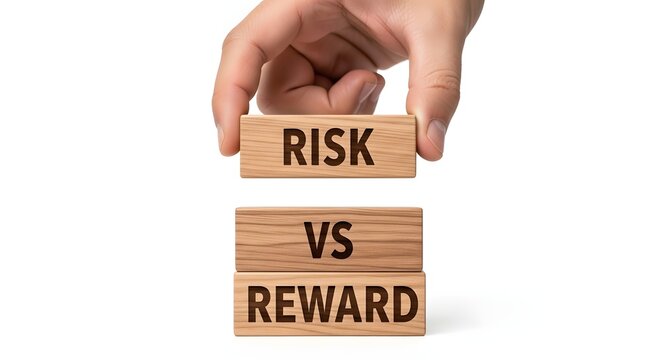 Hand stacking wooden blocks risk vs reward text on white background.