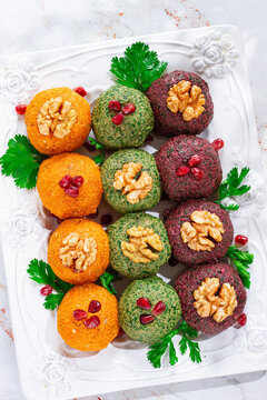 assortment of Pkhali, pumpkin, spinach and beetroot, Georgian dish, on a white plate, appetizer with nuts and spices, no people, homemade,