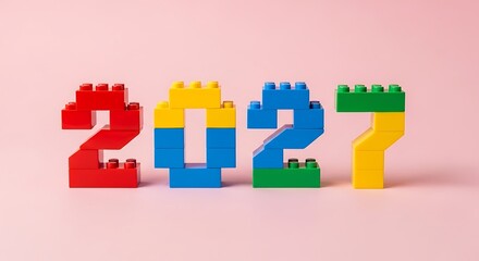 Obraz premium 2027 numbers built with toy blocks in assorted colors against a soft pink backdrop building blocks toy bricks construction toy new year celebration countdown colorful