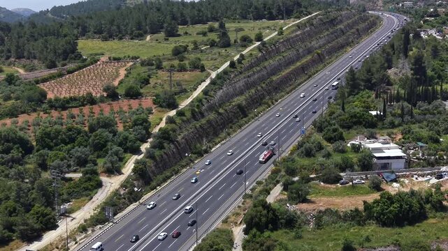 Route One highway traffic on the outskirts of Jerusalem, by Abu Ghosh