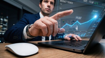 Fototapeta premium Man pointing at holographic financial data on laptop screen with business analytics investment technology computer forecasting presentation analysis hologram interface performance strategy