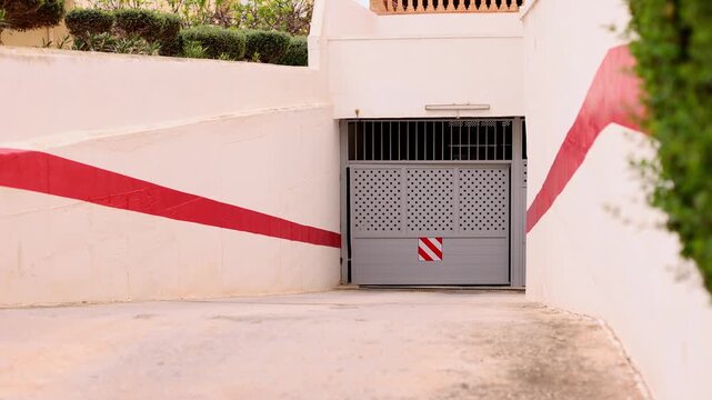 Automatic gate to the parking is opening and the car leaving the parking lot. 4K.