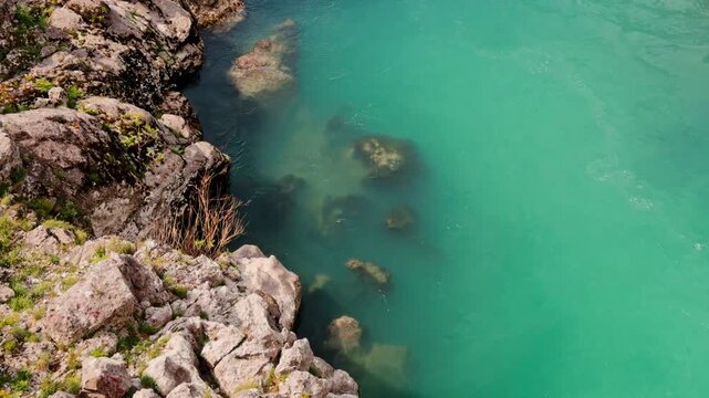 Turquoise Moraca River water with rocks, Podgorica Montenegro