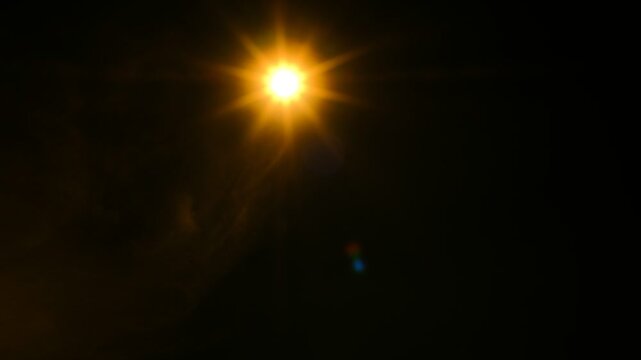 Bright star shines bold against velvet night sky. Lens flare glows with warm, radiant light. Darkness frames star's brilliance, pure and clear. Perfect for cinematic night scenes or cosmic themes