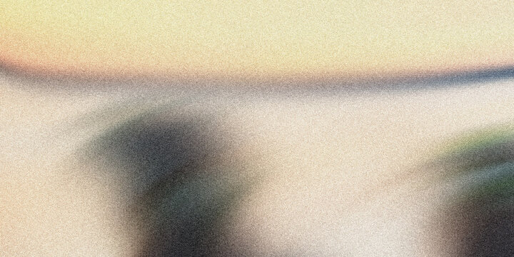 Blurry abstract image with beige and yellow hues and texture