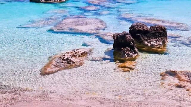 Greece Crete 4K Video of Girl Walking Out of Turquoise Sea on Empty Elafonisi Beach with Pink Sand and Mountains Background Scenic Exotic Island Summer Travel