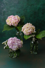 Naklejka premium Blooming hydrangea bouquet in moody light – great for vintage floral wall art or product scenes
