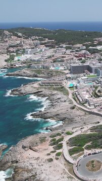 Aerial View of Cala Agulla Beach and Hotel Buildings Mallorca Spain