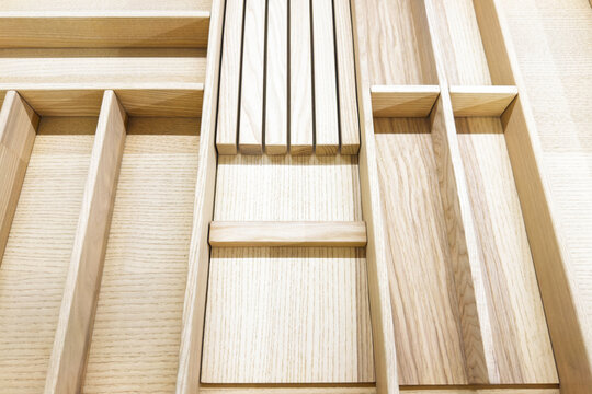 Empty wooden cutlery drawer organizer with knife block