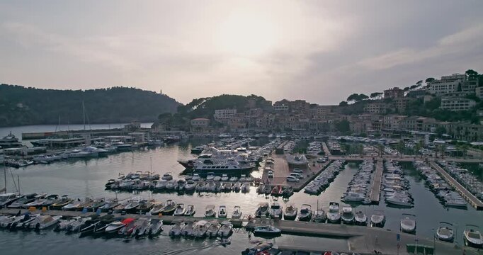 Sunset Over Port Soller Harbor with Yachts and Boats in Mallorca Spain